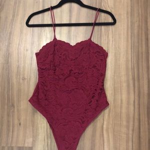 Red lacy body suit
